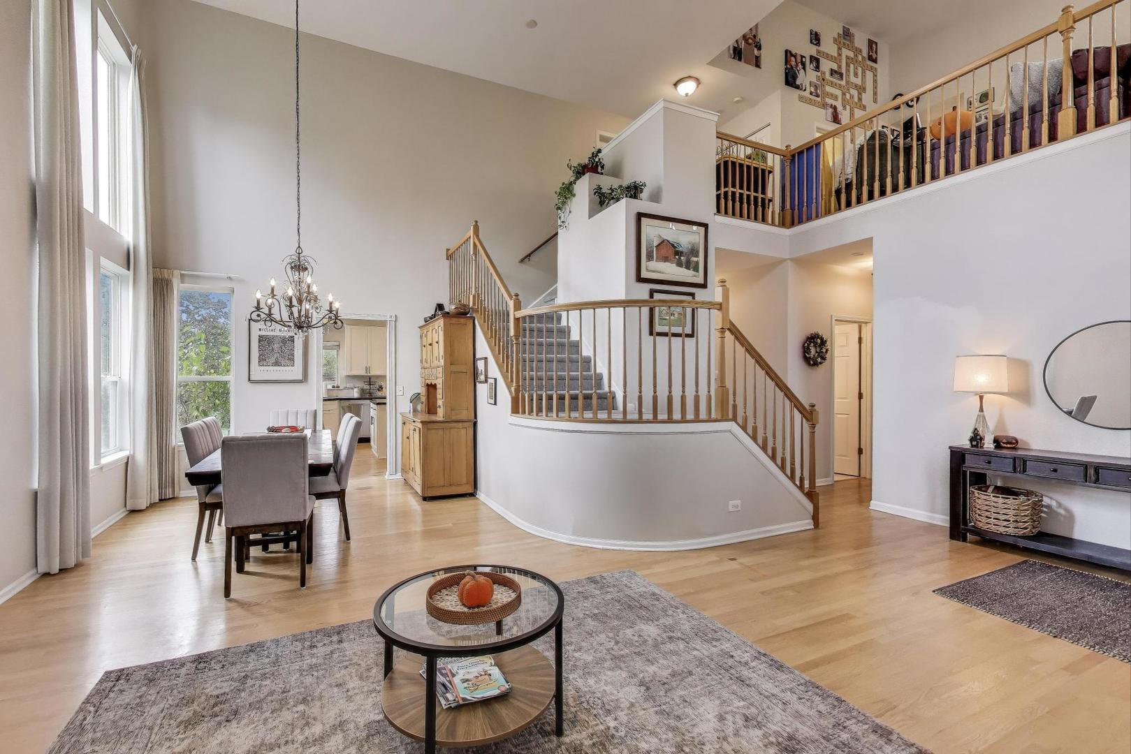 1010 Evergreen Street Mundelein, IL 60060 - Photo 4 of 28 a living room with furniture a rug and a chandelier