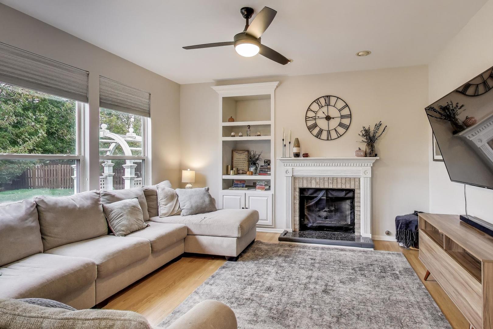 1010 Evergreen Street Mundelein, IL 60060 - Photo 9 of 28 a living room with furniture and a fireplace