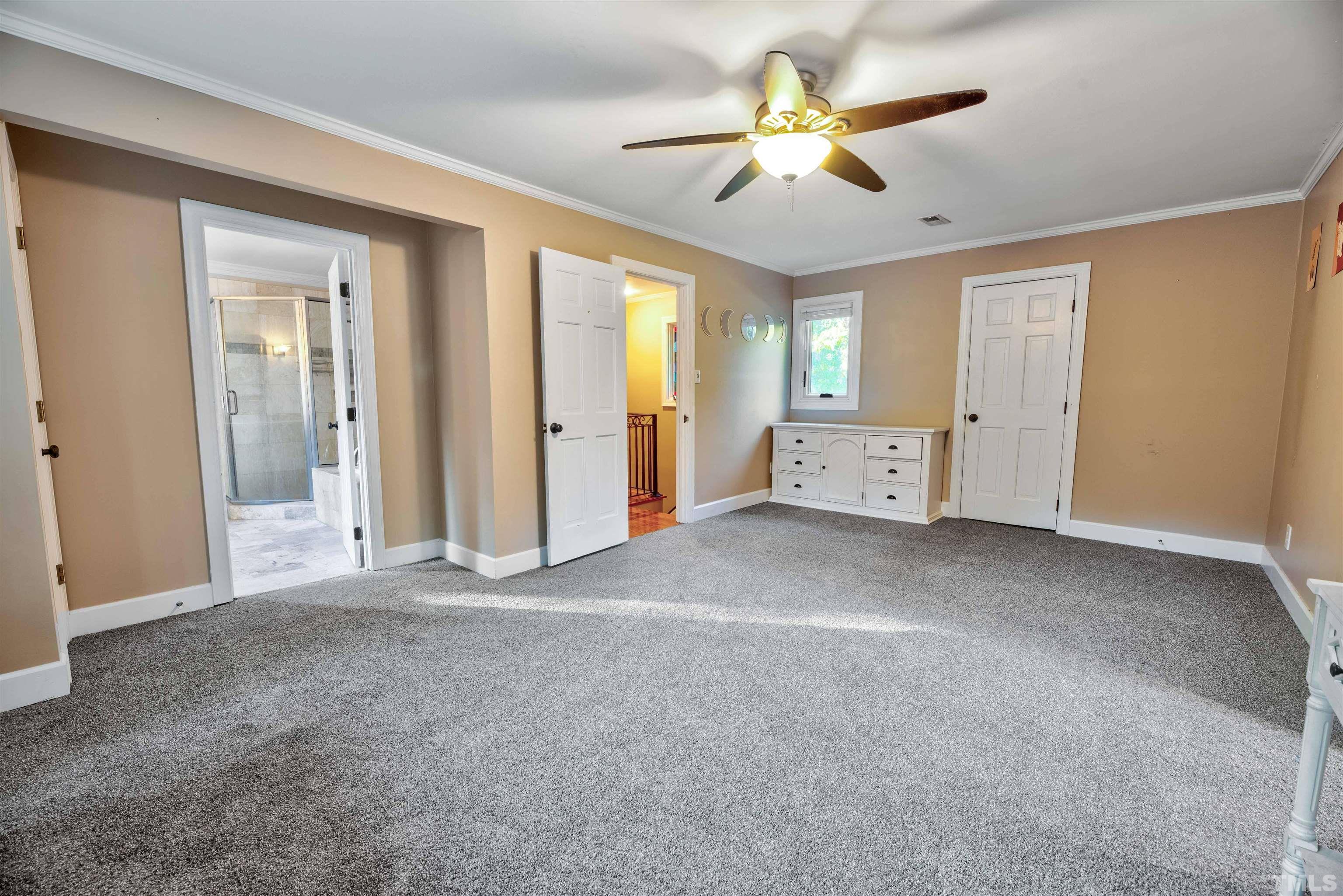9400 Springdale Drive Raleigh, NC 27613 - Photo 22 of 29 a view of an empty room with a window