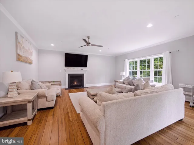 a living room with furniture fireplace and flat screen tv