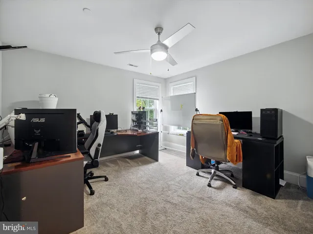 a view of a workspace with furniture