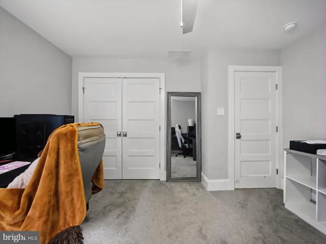 a view of a hallway with a window and stairs