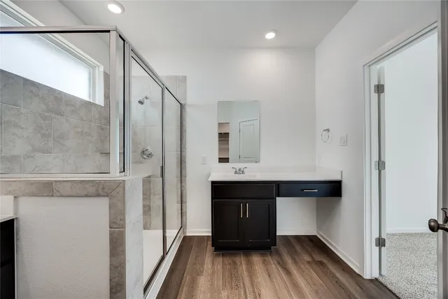 a view of cabinets and wooden floor