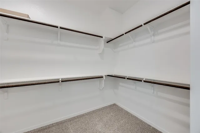 a view of an empty walk in closet