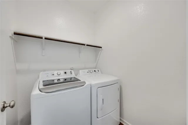 a utility room with dryer and washer