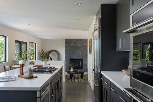 a kitchen with a stove and a refrigerator