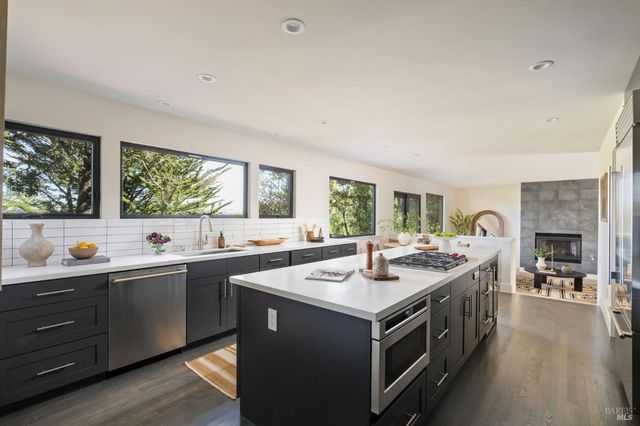 a kitchen with a sink and stove