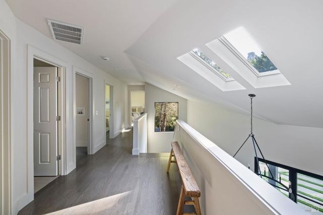 a view of a livingroom with furniture and stairs