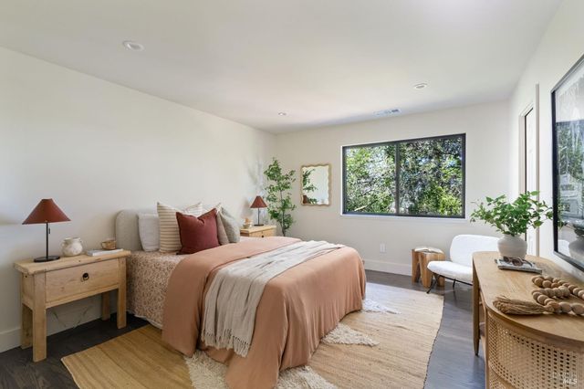 a bedroom with bed and a window