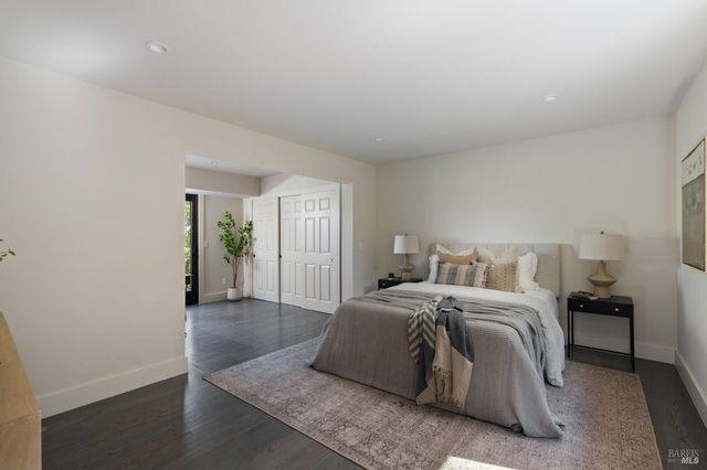 a spacious bedroom with a bed and a window