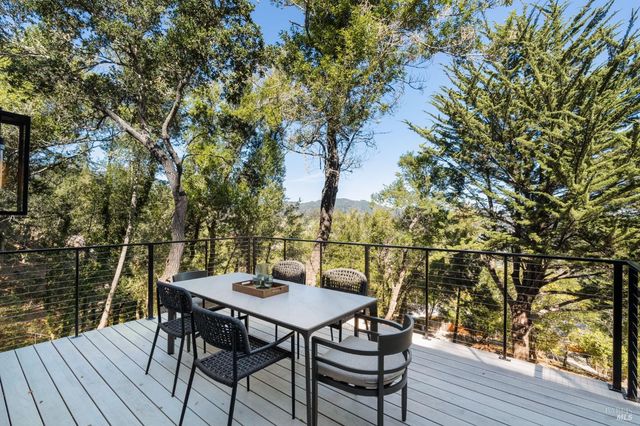 a view of a chairs and table on the wooden floor