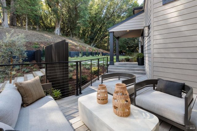 a view of a deck with a table and chairs