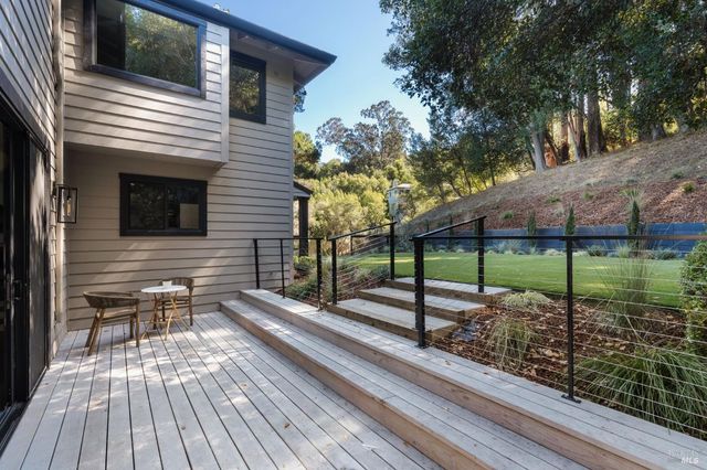 a view of a house with a backyard