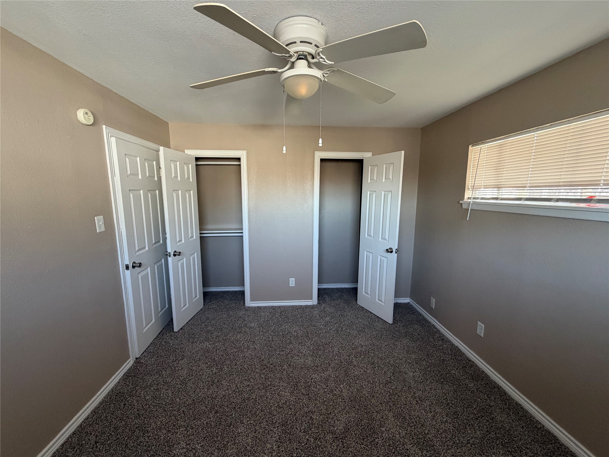 3113 Arbor Street, Unit 3 Houston, TX 77004 - Photo 5 of 11 an empty room with fan and windows