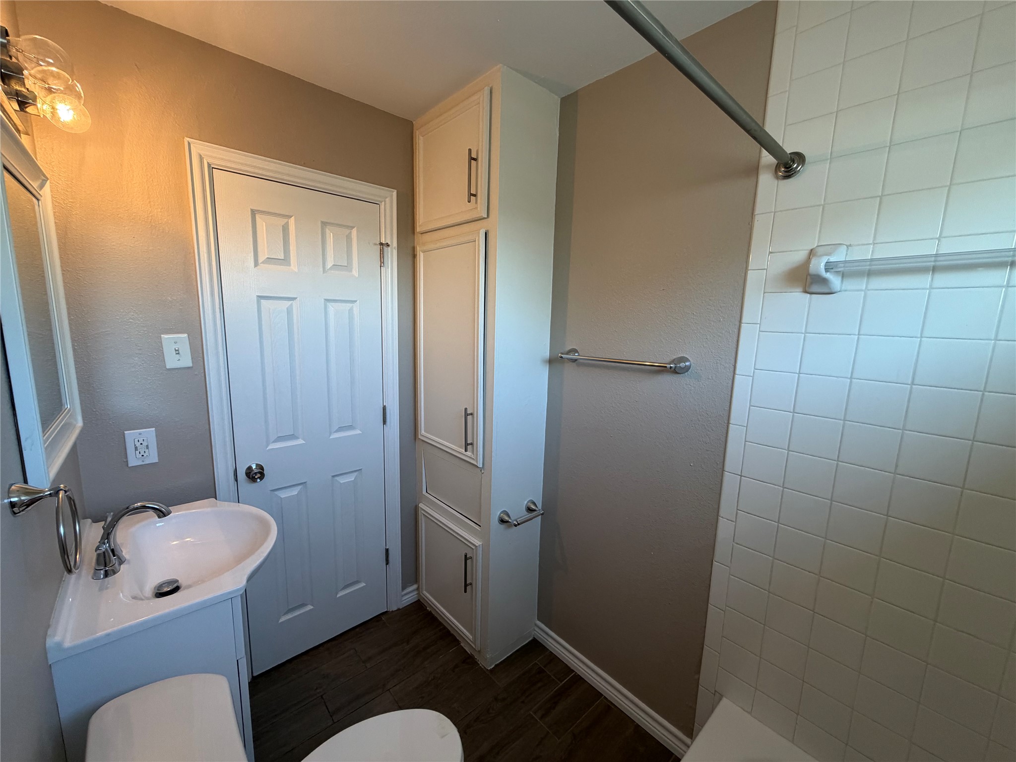 3113 Arbor Street, Unit 3 Houston, TX 77004 - Photo 6 of 11 a bathroom with a granite countertop sink toilet and shower