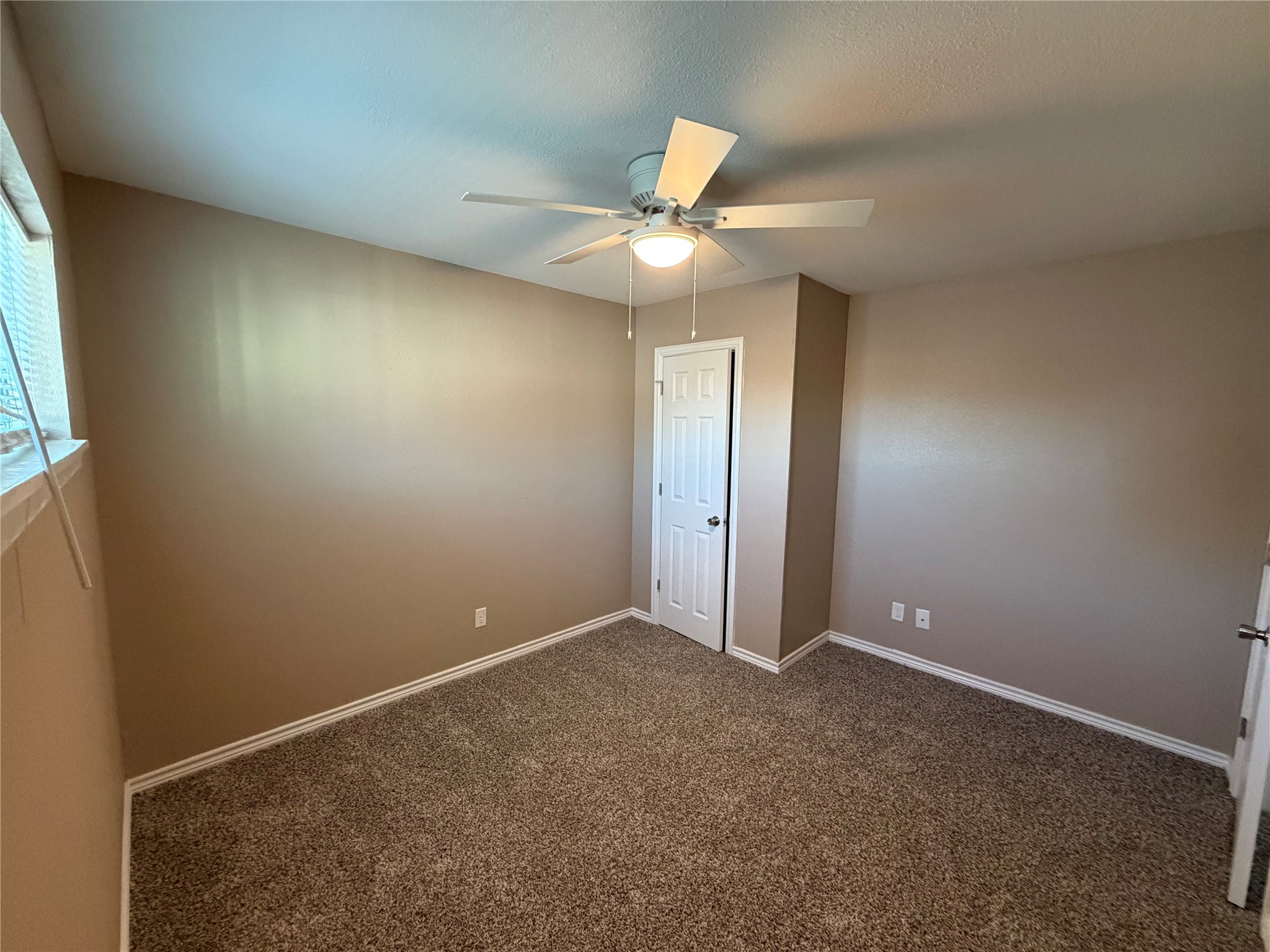3113 Arbor Street, Unit 3 Houston, TX 77004 - Photo 7 of 11 an empty room with closet and a chandelier fan