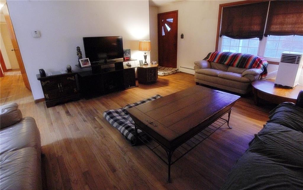 247 Moorehead Road Sarver, PA 16055 - Photo 3 of 41 a living room with furniture and a flat screen tv