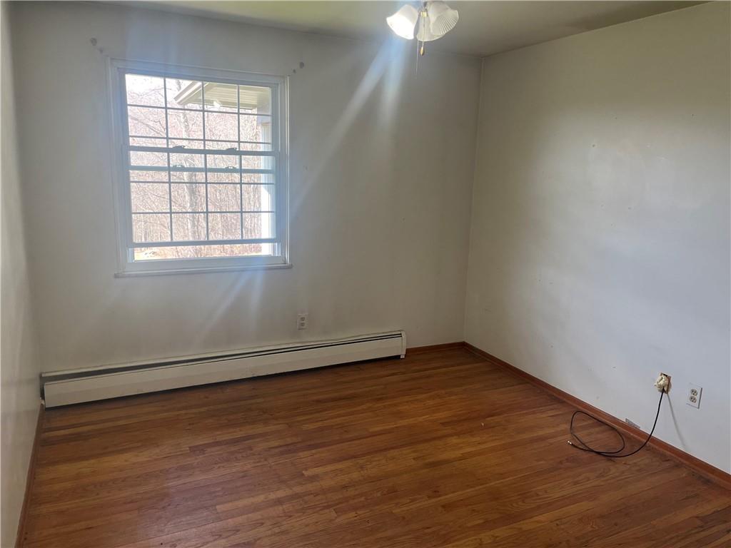 247 Moorehead Road Sarver, PA 16055 - Photo 36 of 41 an empty room with wooden floor cabinet and windows