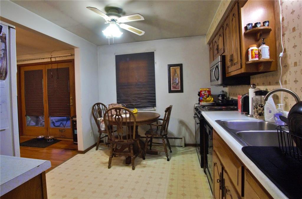 247 Moorehead Road Sarver, PA 16055 - Photo 6 of 41 a view of a dining room with furniture and a chandelier