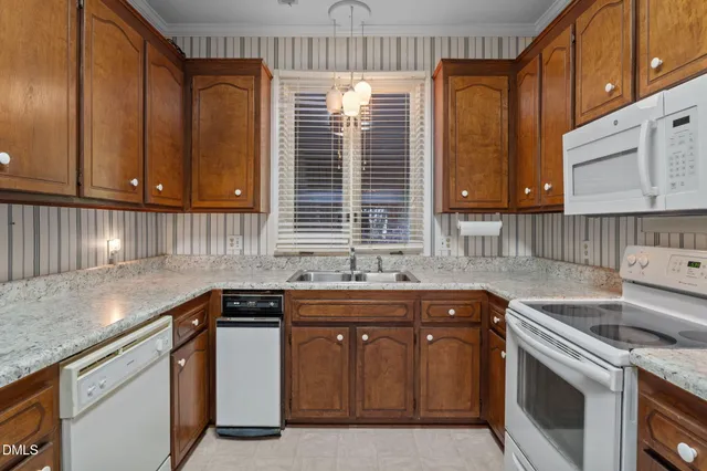 a kitchen that has a sink and a stove