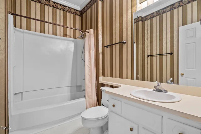 a view of a hallway with closet and wooden floor