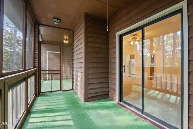 a view of a porch with wooden floor and outdoor space