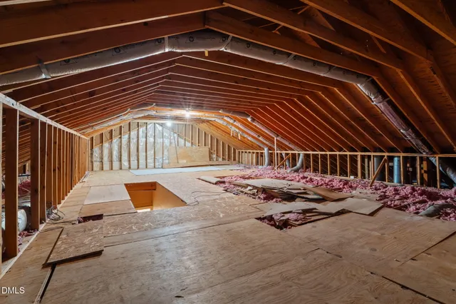 a car parked in front of a brick house