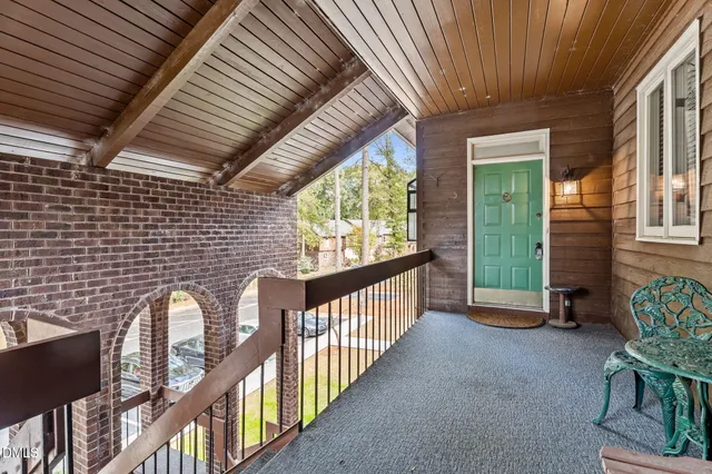 a view of a porch with furniture