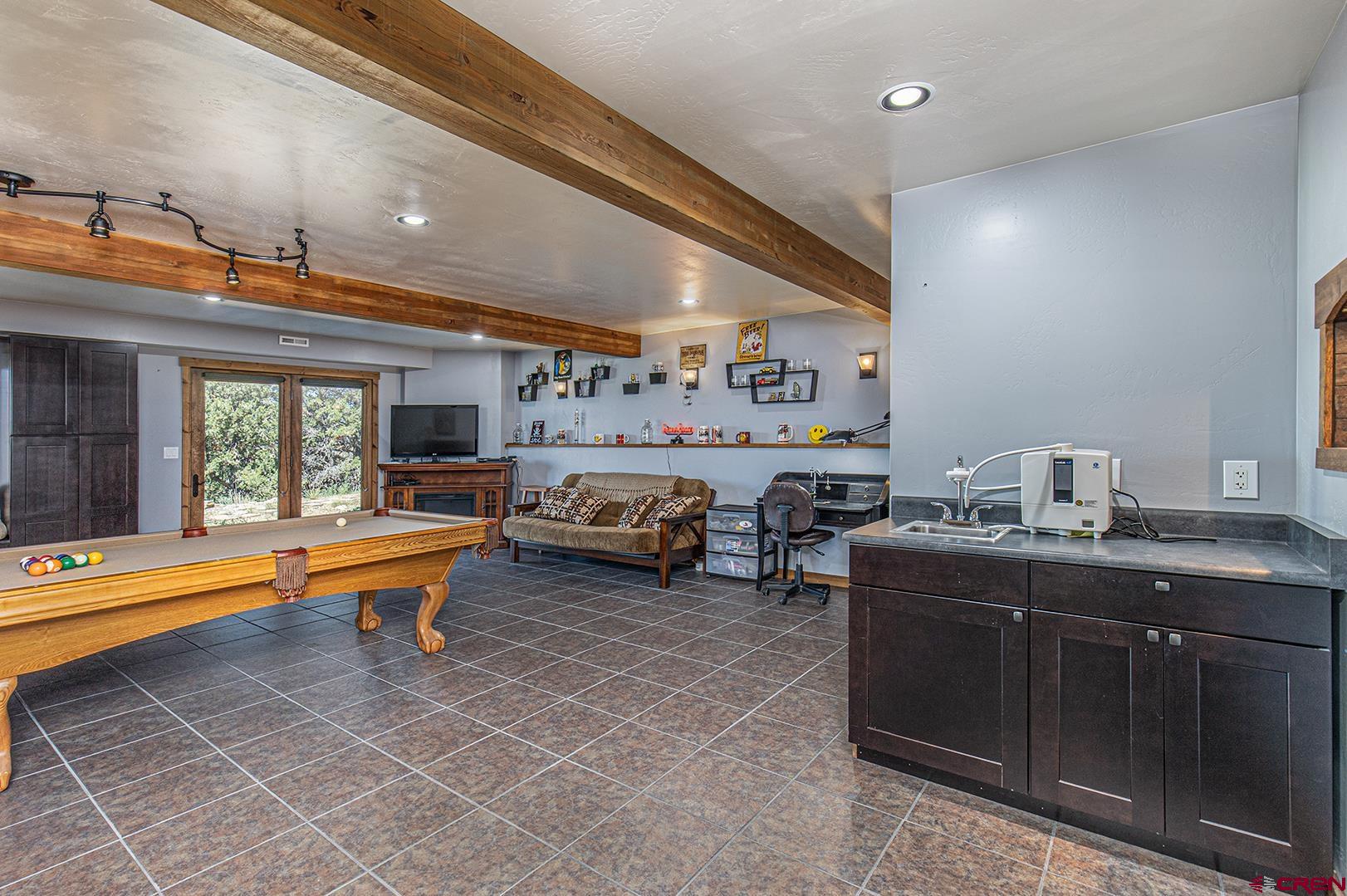 616 North Rainbow Road Durango, CO 81303 - Photo 30 of 35 Bonus space on bottom level with own entrance. Currently used as a game room.