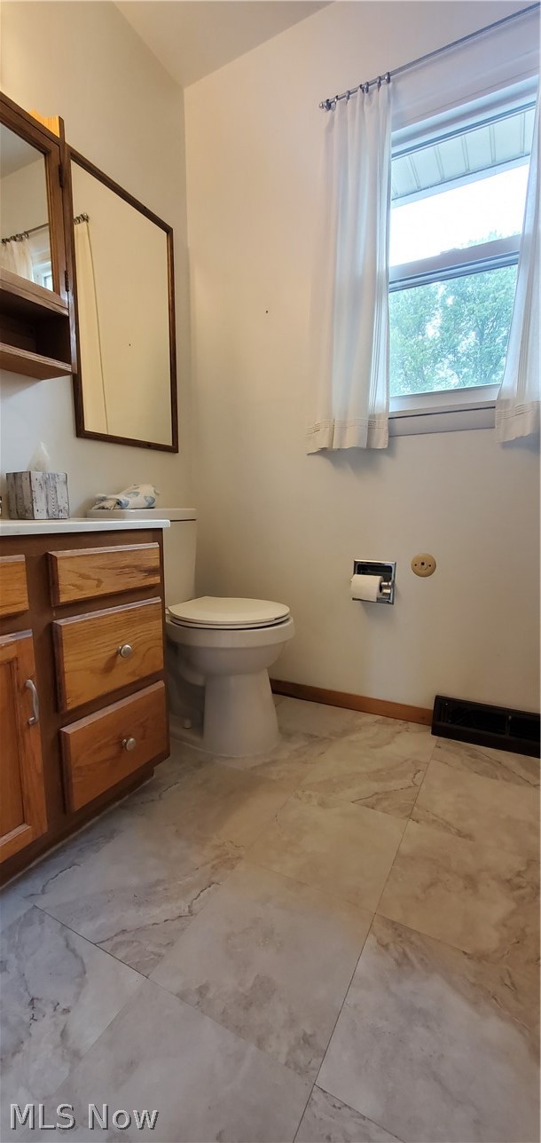 1515 East Bogart Road Sandusky, OH 44870 - Photo 19 of 23 Bathroom with vanity, tile patterned flooring, and toilet