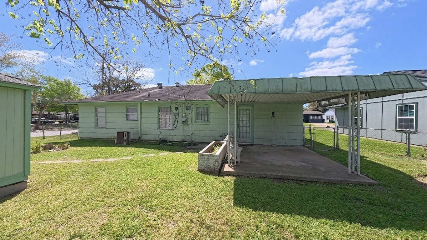 5879 Belneath Street Houston, TX 77033 - Photo 9 of 10 a view of a backyard with wooden fence