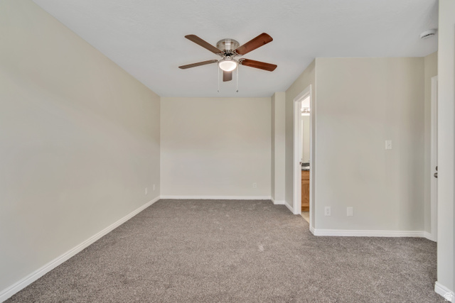 1118 North Ridge Court Spanish Fork, UT 84660 - Photo 19 of 32 Carpeted empty room featuring baseboards and a ceiling fan