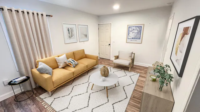 a living room with furniture and wooden floor