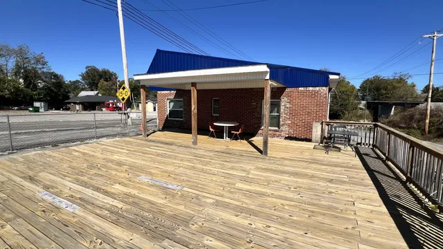 a view of a terrace with wooden floor and outdoor space
