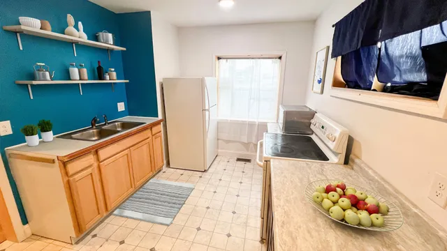 a storage room with wooden floor and furniture