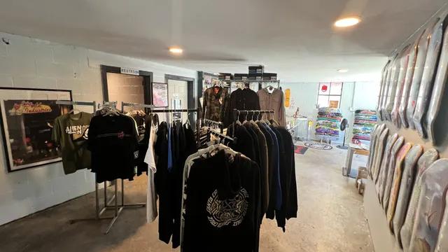 a view of a living room with clothes and shoes