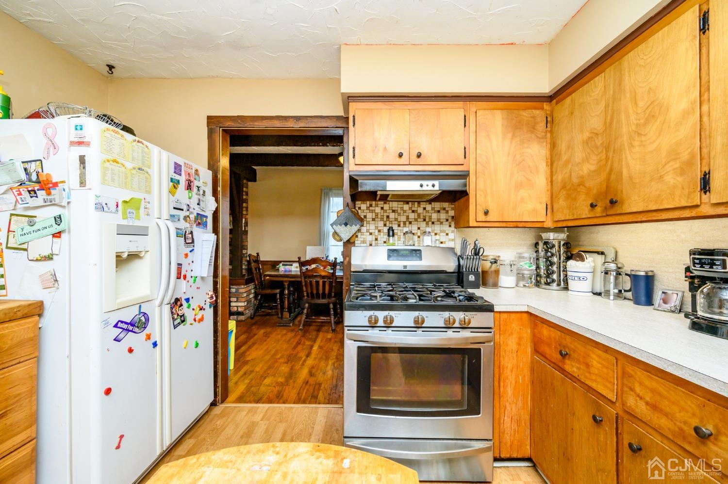 7 Lozaw Road Franklin, NJ 07416 - Photo 15 of 27 a kitchen with stainless steel appliances granite countertop a stove and a refrigerator