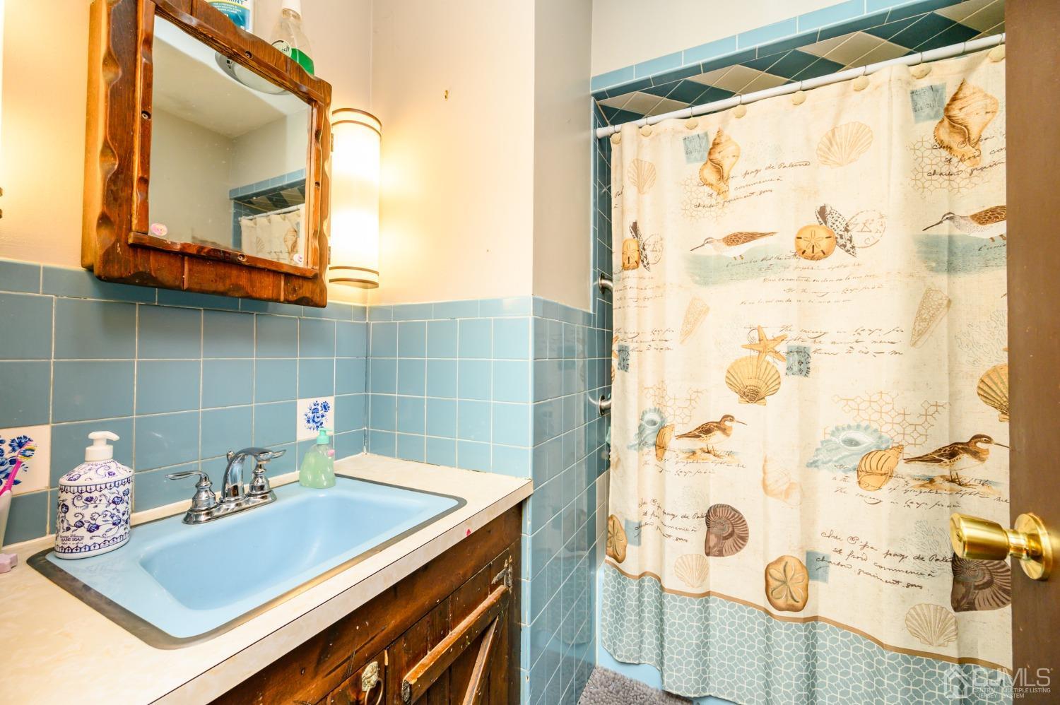 7 Lozaw Road Franklin, NJ 07416 - Photo 16 of 27 a bathroom with a sink and a mirror