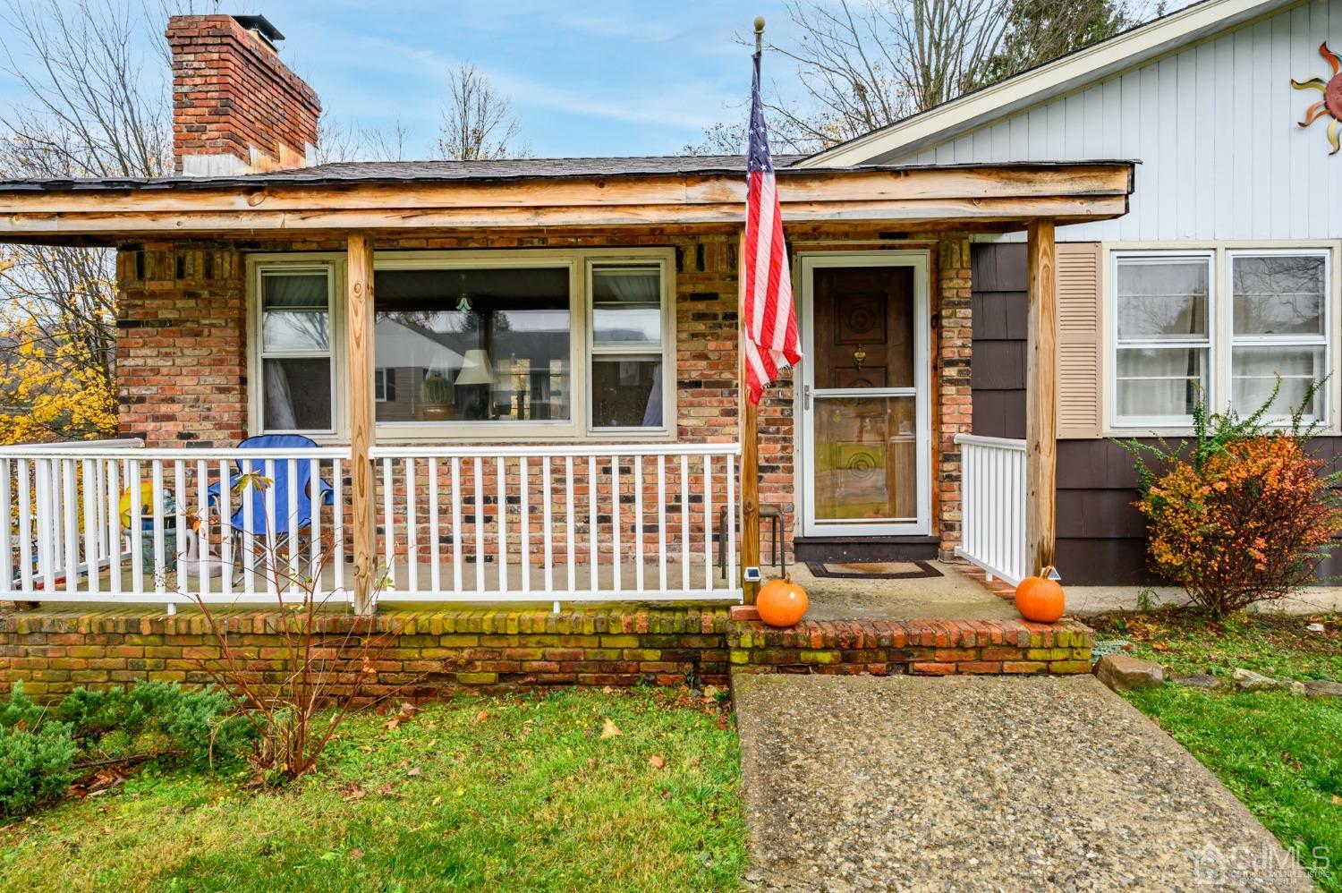 7 Lozaw Road Franklin, NJ 07416 - Photo 2 of 27 front view of a house with a porch