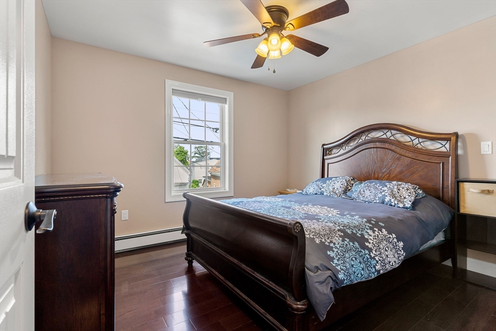 241 Plain Street Lowell, MA 01852 - Photo 12 of 33 a bedroom with a bed and a window