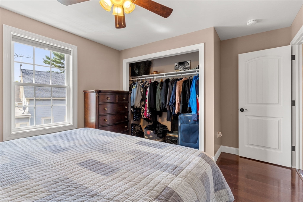 241 Plain Street Lowell, MA 01852 - Photo 18 of 33 a bedroom with a bed and a window