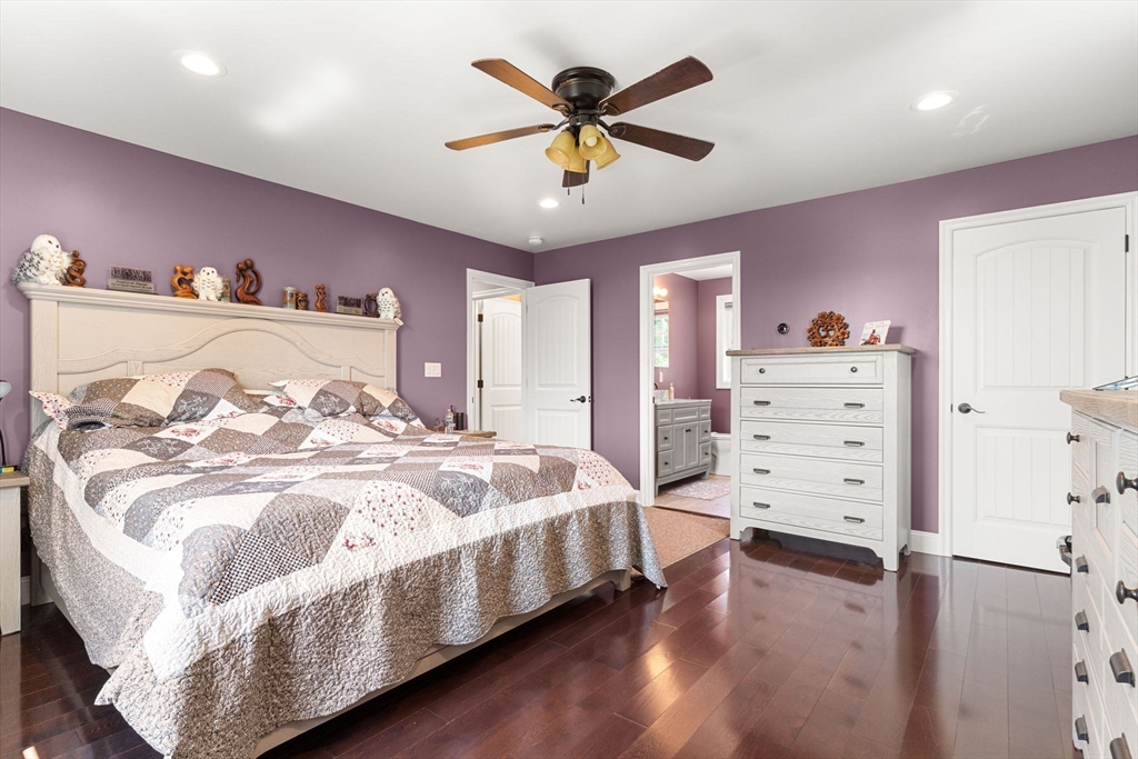 241 Plain Street Lowell, MA 01852 - Photo 23 of 33 a spacious bedroom with a bed and a dresser