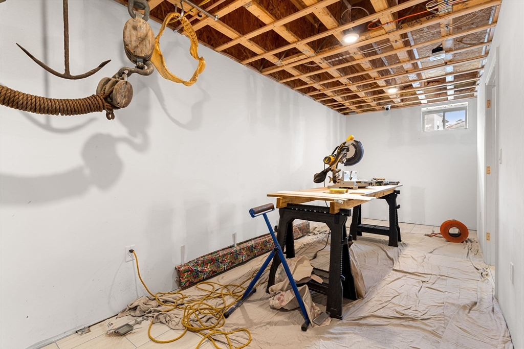 241 Plain Street Lowell, MA 01852 - Photo 28 of 33 a view of a room with table and chair