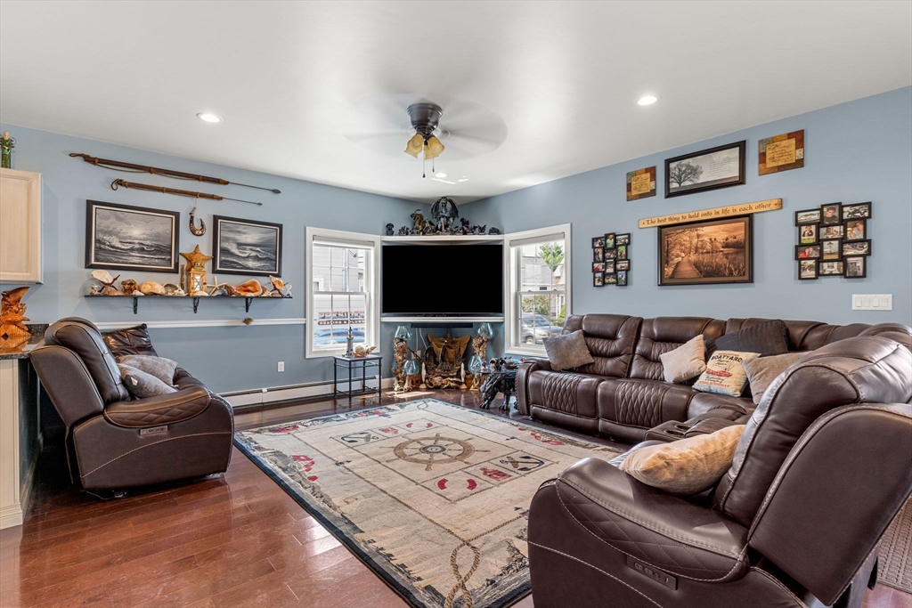 241 Plain Street Lowell, MA 01852 - Photo 8 of 33 a living room with furniture and a flat screen tv