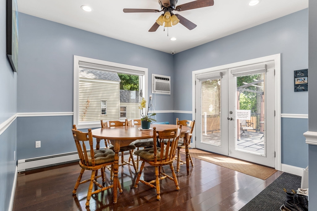 241 Plain Street Lowell, MA 01852 - Photo 10 of 33 a view of a dining room with furniture window and wooden floor
