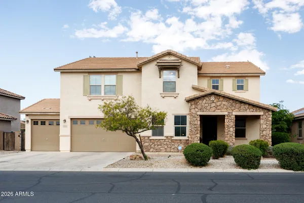 a front view of a house with garage