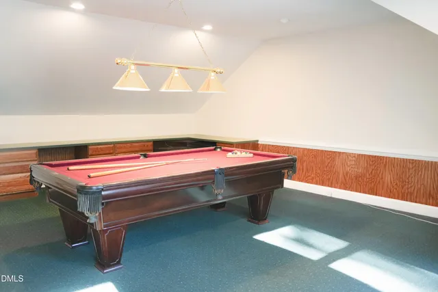 a view of room with stairs and wooden floor