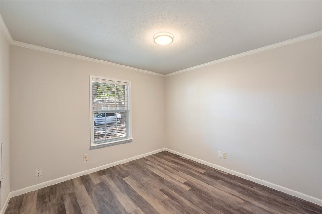 2038 Ash Hill Road Carrollton, TX 75007 - Photo 12 of 28 an empty room with windows