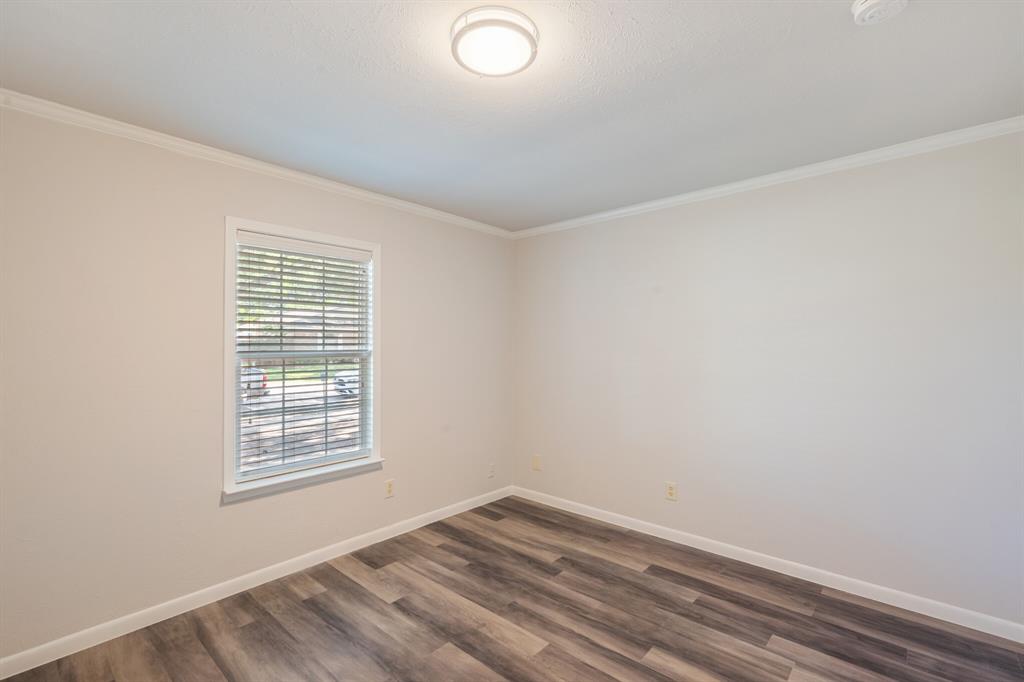 2038 Ash Hill Road Carrollton, TX 75007 - Photo 18 of 28 an empty room with a window