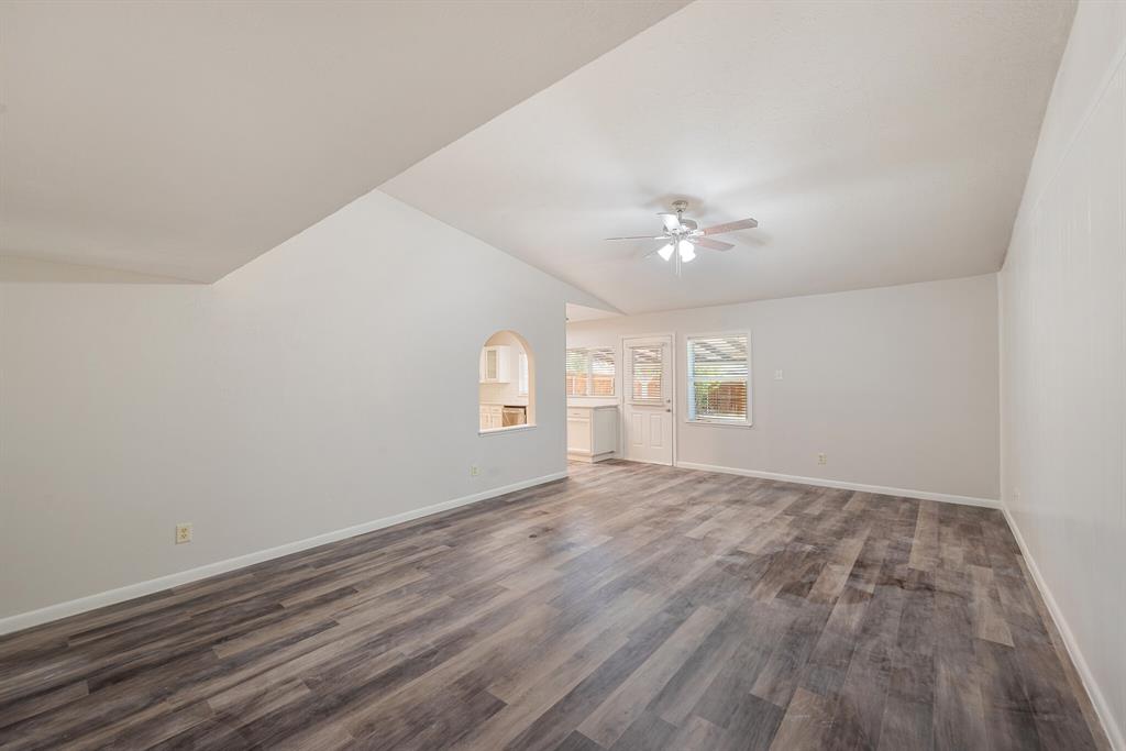 2038 Ash Hill Road Carrollton, TX 75007 - Photo 20 of 28 wooden floor in an empty room with a window
